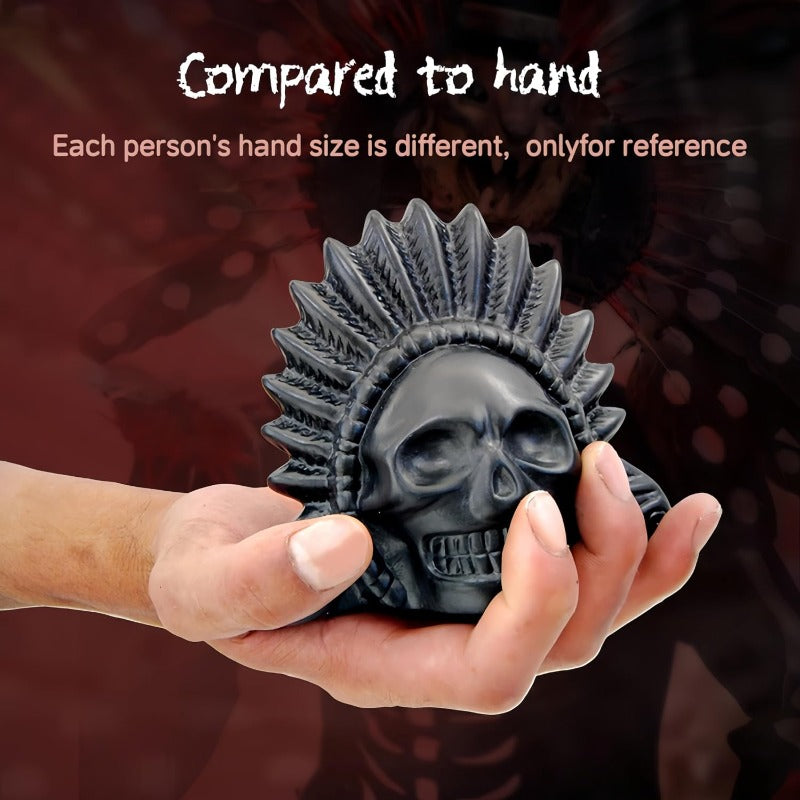 Hand holding black ceramic skull whistle