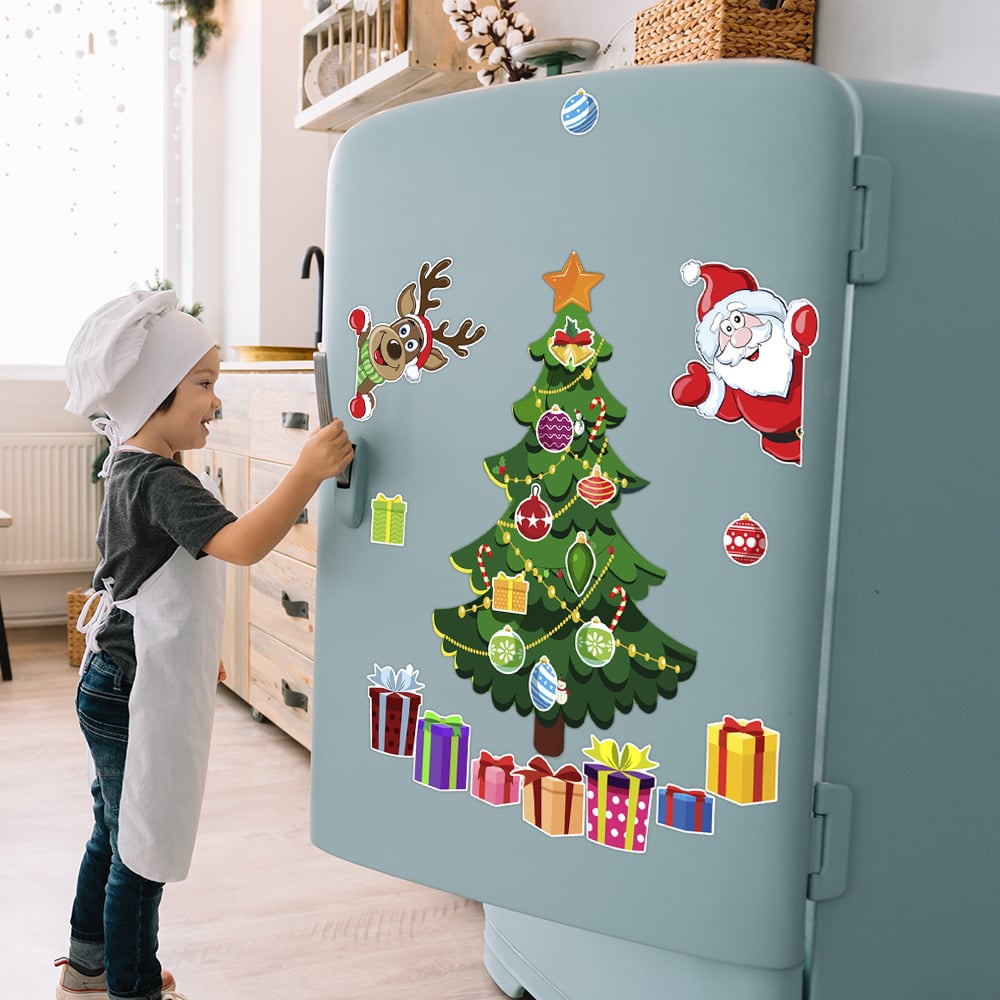 Child decorating a refrigerator with movable Christmas magnets