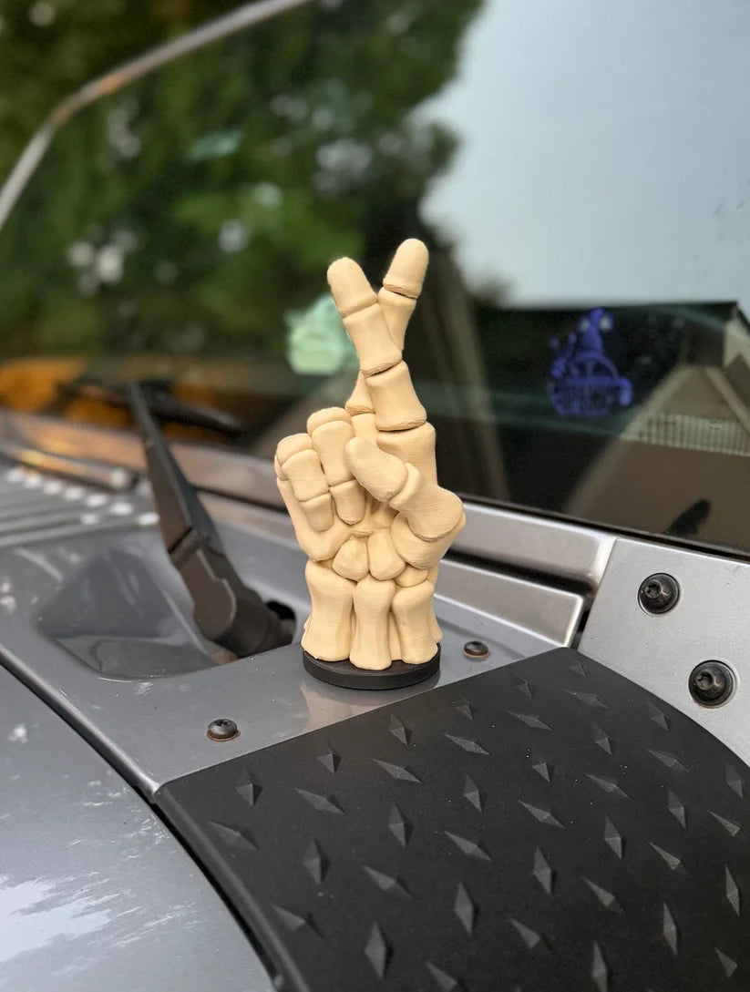 Fingers crossed skeletal magnetic vehicle ornament