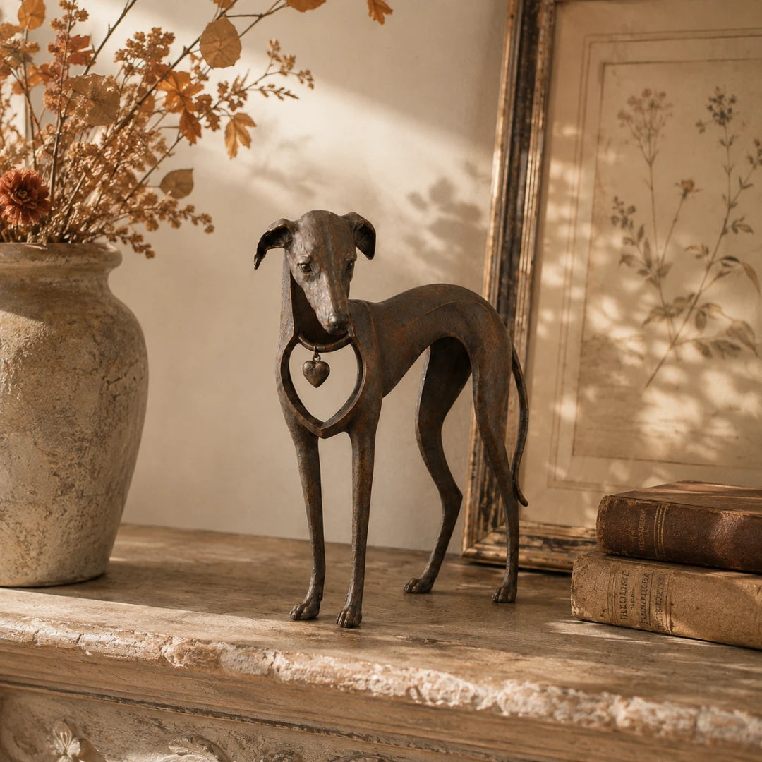 Vintage dog sculpture styled on a console table