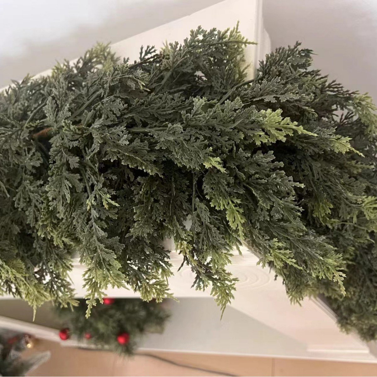 Close-up of layered artificial cedar foliage