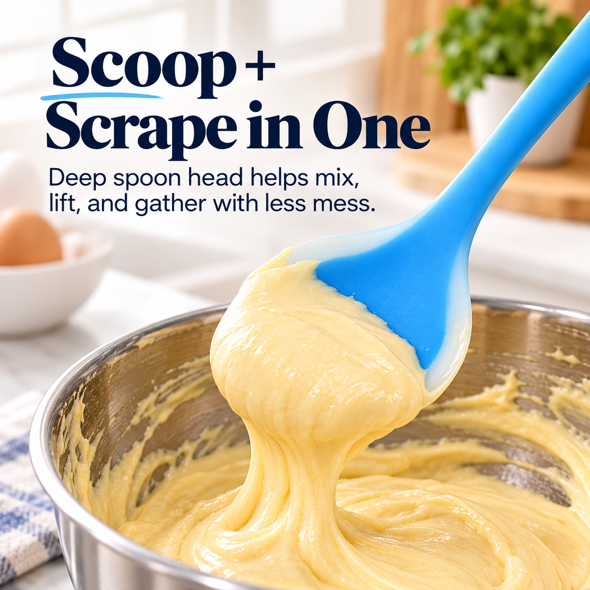Silicone spoon spatula lifting a generous scoop of thick yellow batter from a stainless steel mixing bowl
