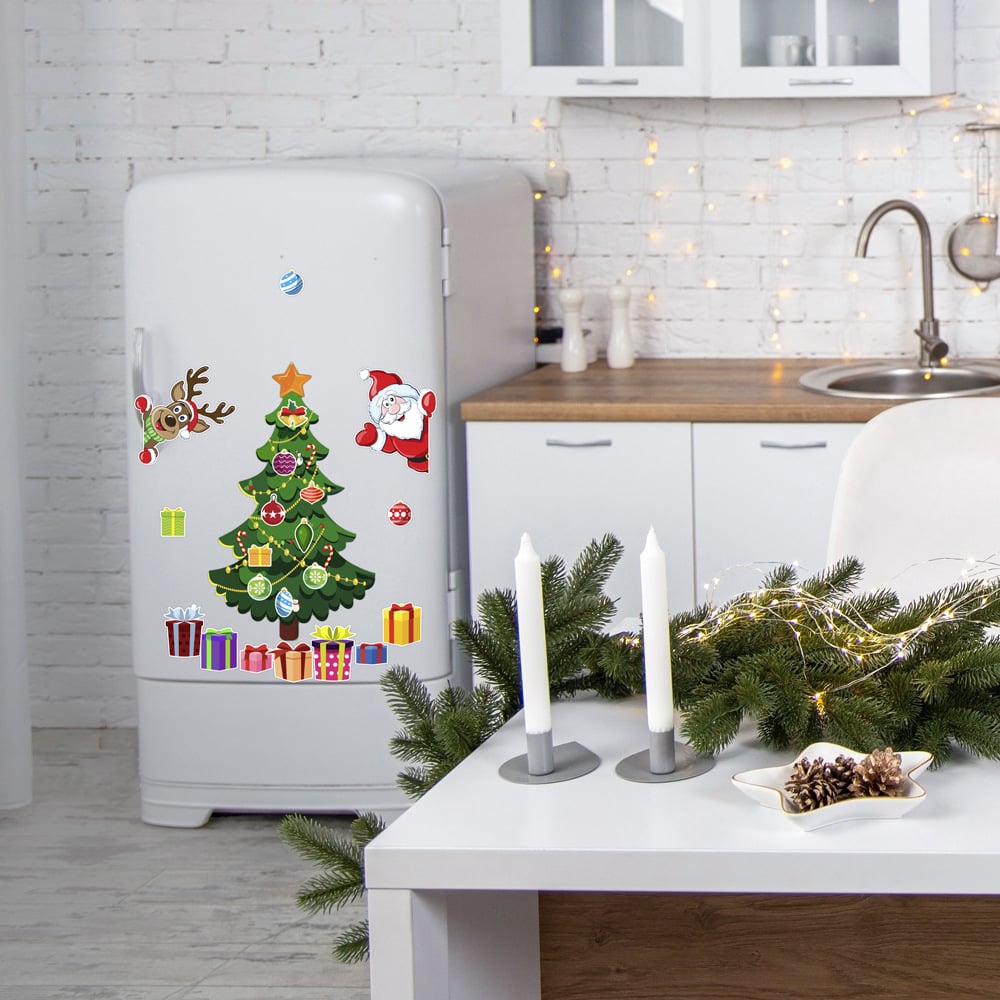 Christmas magnetic tree and ornaments decorating a refrigerator in a festive kitchen
