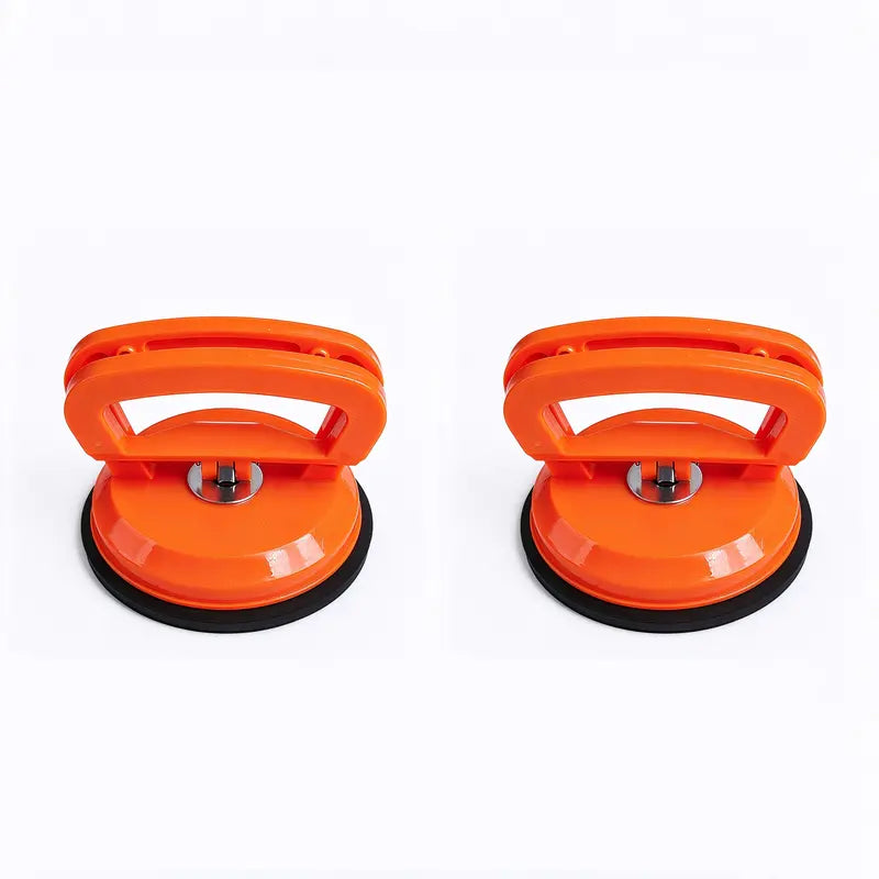 Two orange suction pullers arranged side by side on a white background