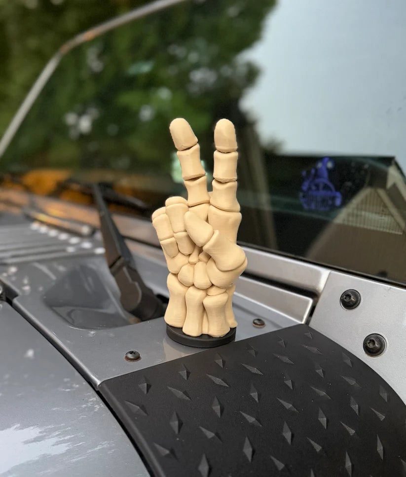 Magnetic peace sign vehicle decoration attached to flat metal body panel