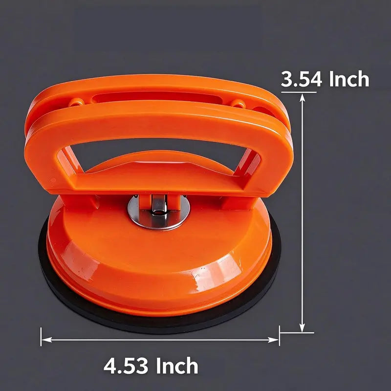 Dimension illustration of orange dent suction puller marked 4.53 inches wide and 3.54 inches high