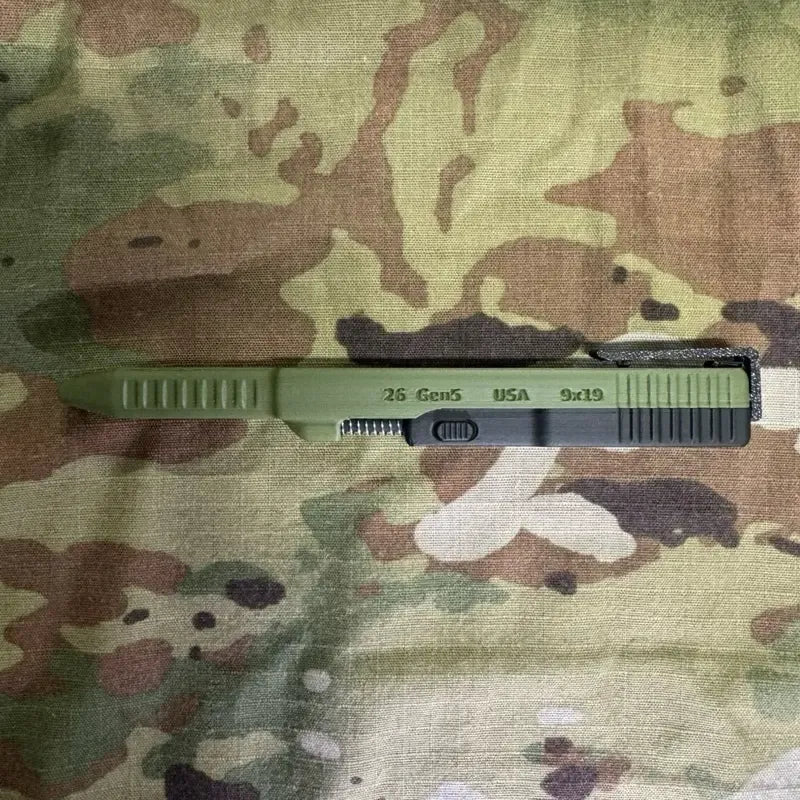Green and black slide-action novelty ballpoint pen