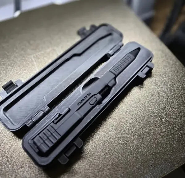 Black slide-action novelty pen inside fitted storage case