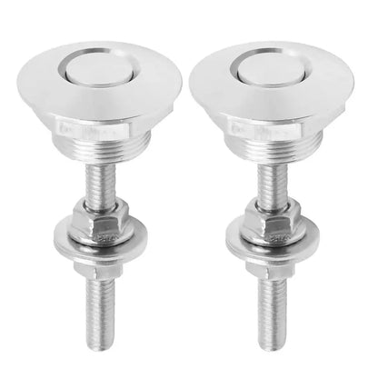 Close-up of two matching silver round push-button quick-release latches with threaded metal studs