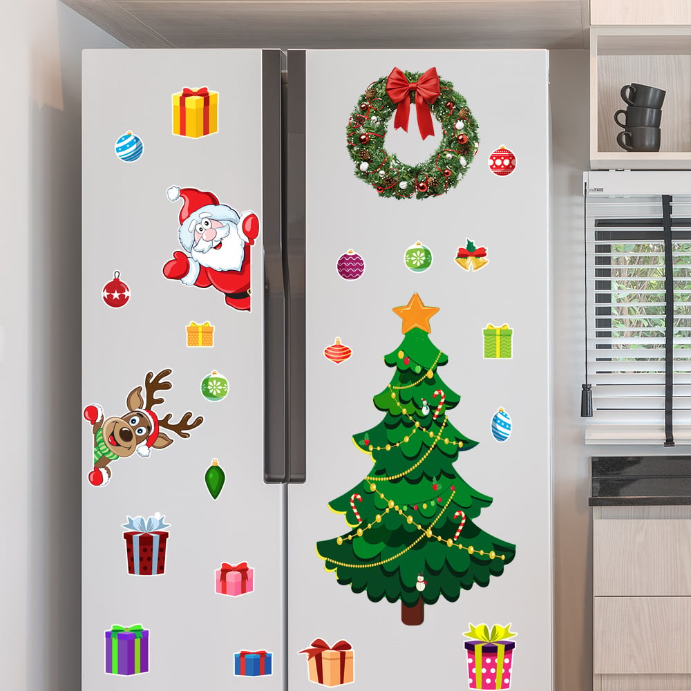 Christmas magnetic decorations arranged across a refrigerator with Santa reindeer tree ornaments and gifts