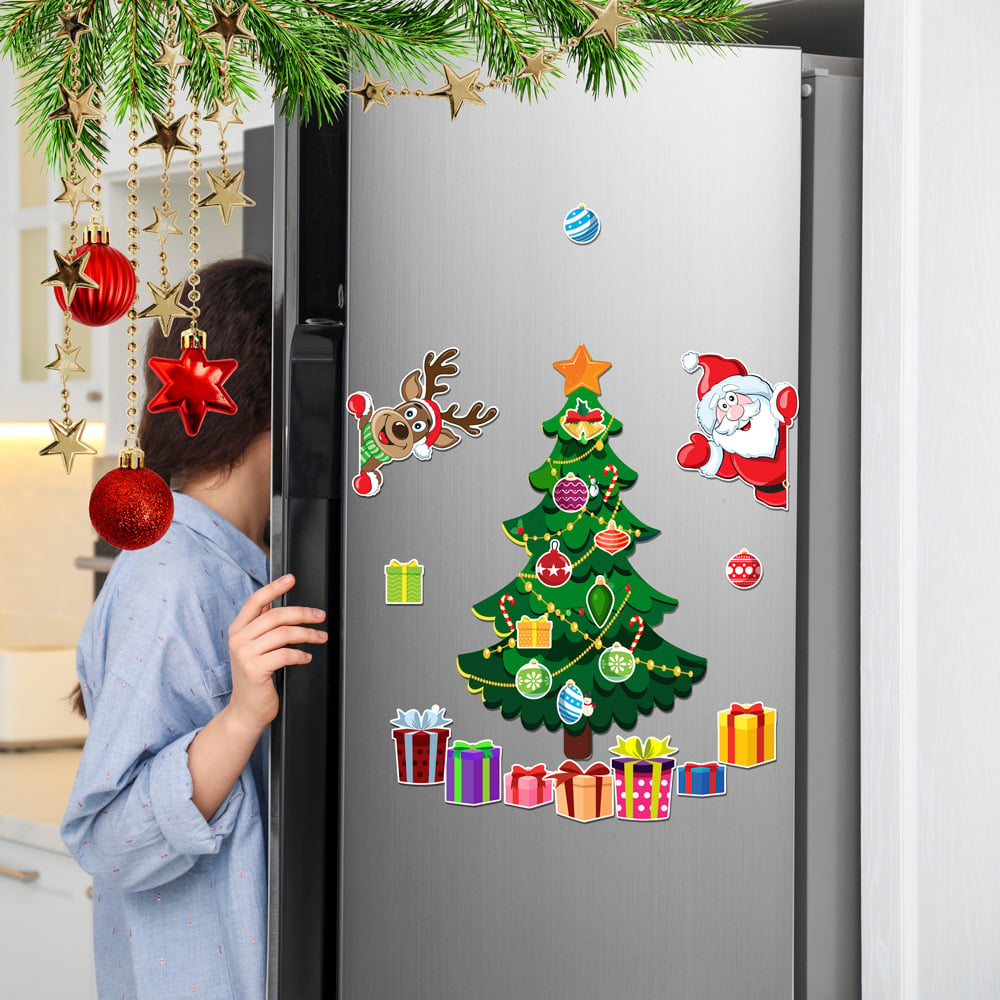 Christmas tree Santa reindeer and gift magnets decorating a refrigerator
