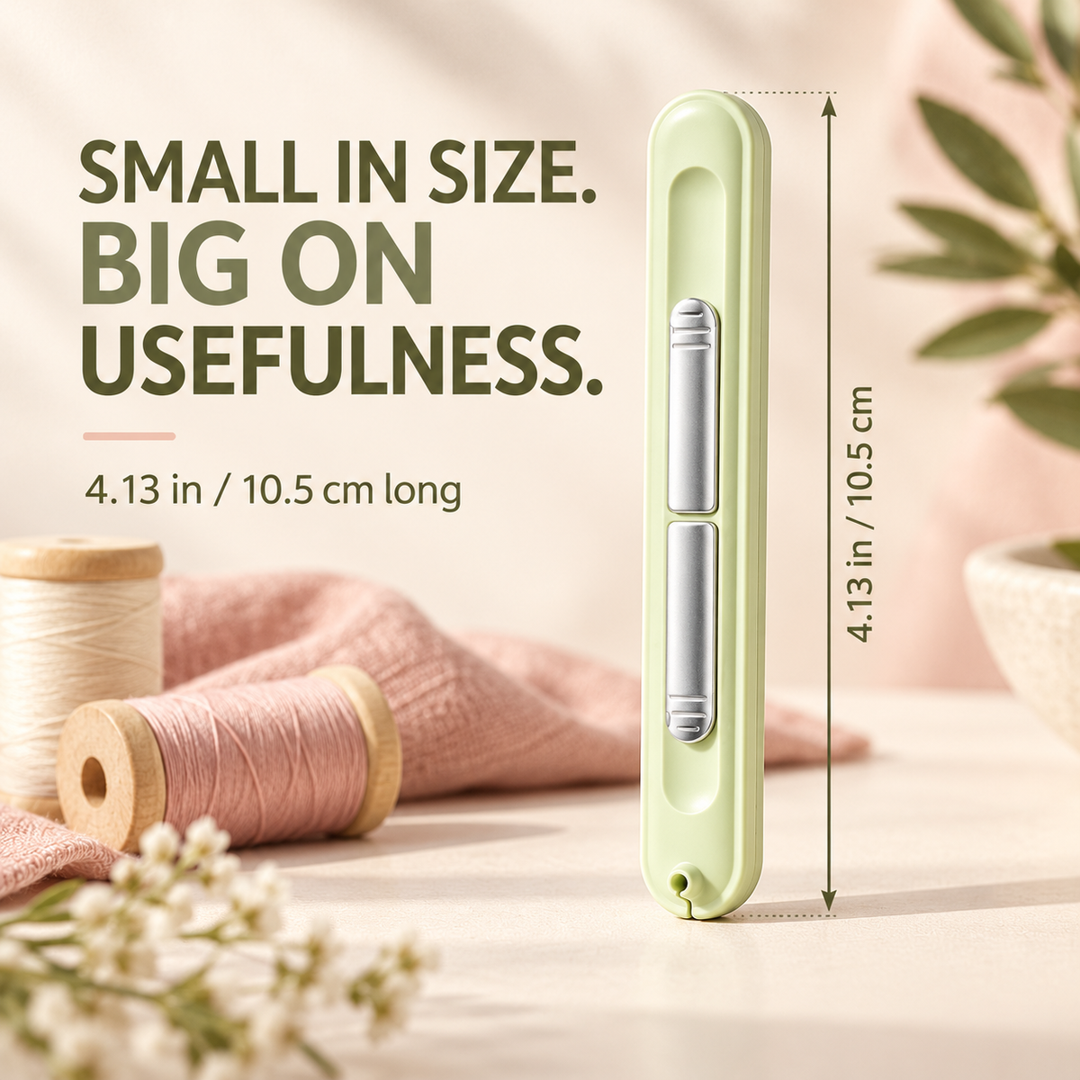 Compact needle threader and seam ripper measuring approximately 10.5 centimeters long