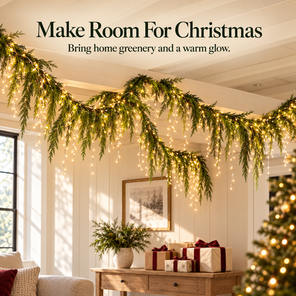 Evergreen garland and warm lights styled for Christmas