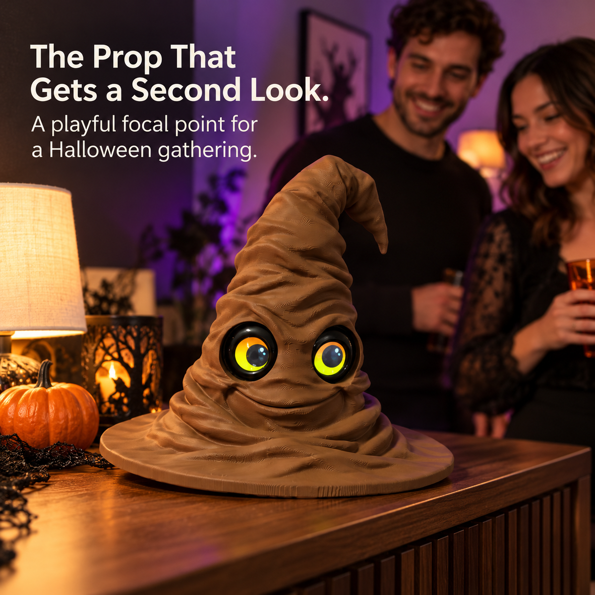 Magic hat with moving eyes displayed on a Halloween table with pumpkins and warm purple lighting