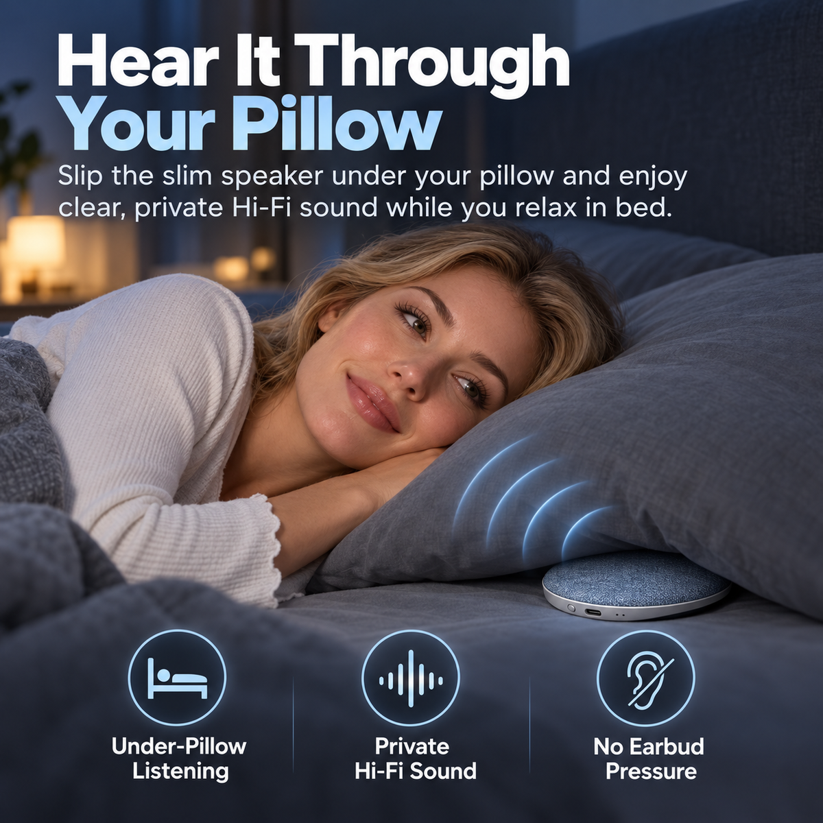 Woman relaxing in bed beside a slim fabric-covered Bluetooth pillow speaker placed under her pillow