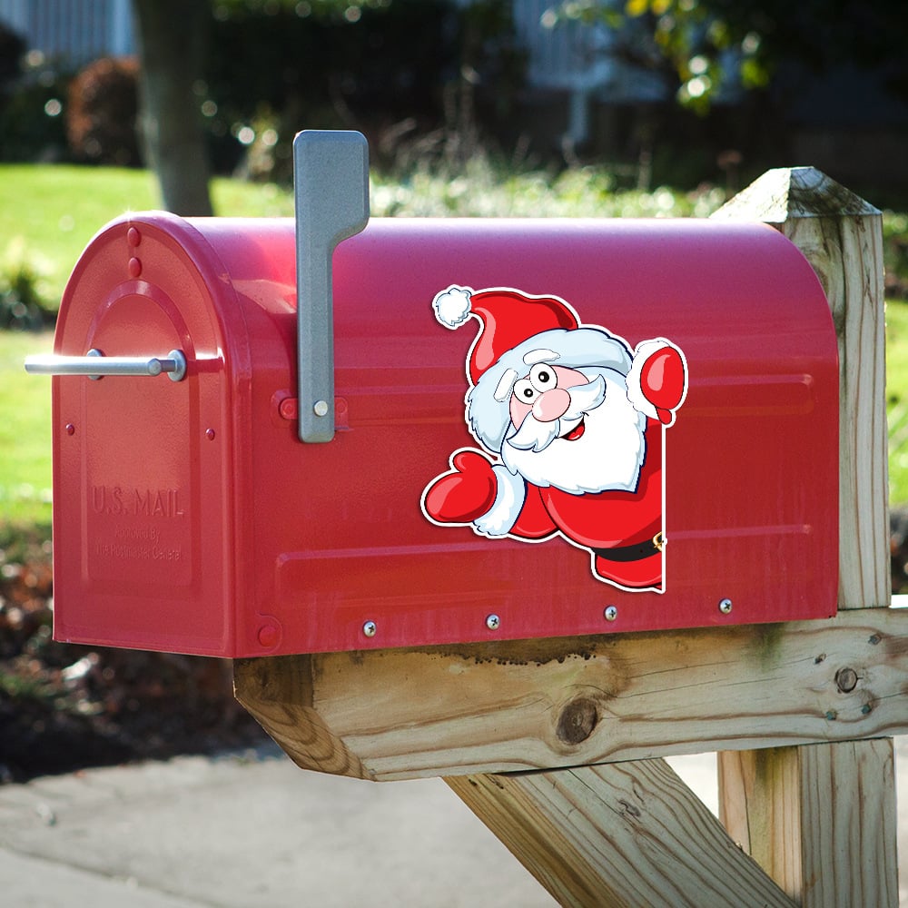 Santa Christmas magnet attached to a red metal mailbox