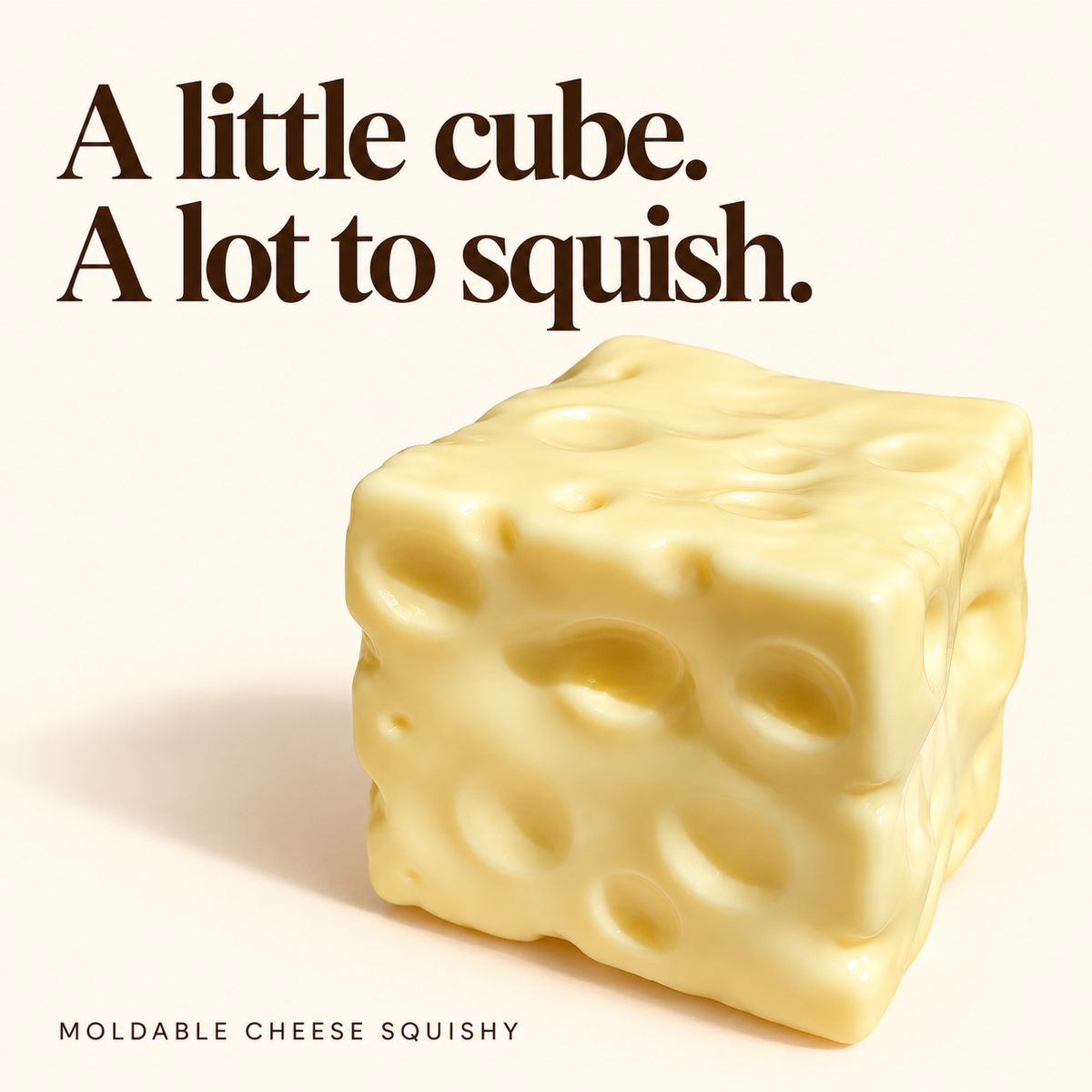 Yellow moldable cheese cube squishy with dimpled texture