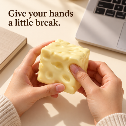 Cheese cube squishy held at a desk for a tactile break