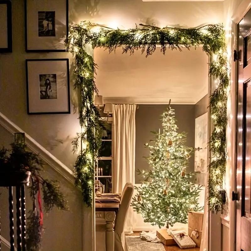 Cedar garland styled around doorway with warm Christmas lights