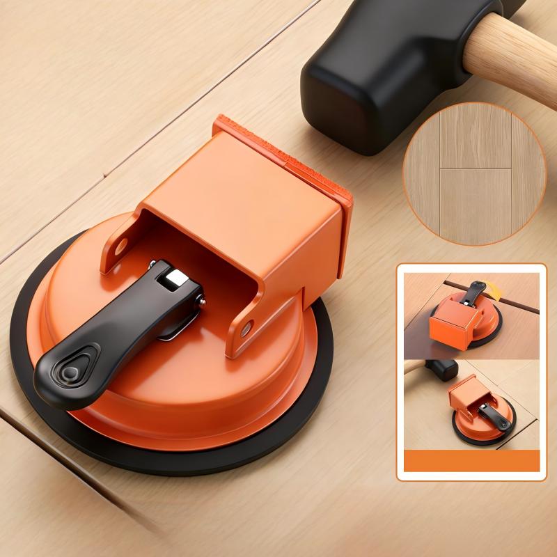 Floor gap fixer suction tool beside a rubber mallet on wood flooring