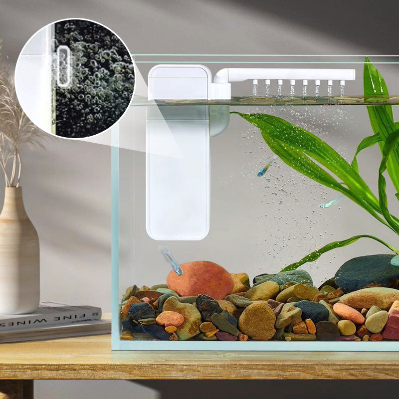 Compact aquarium filter installed on a small fish tank